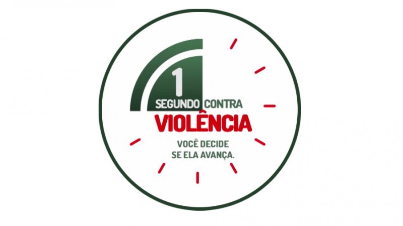Logo da campanha da Agert com um relógio estilizado e a frase "1 segundo contra a violência. Você decide se ela avança".