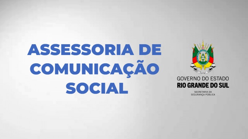 Quadro cinza com texto azul - Assessoria de Comunicação Social. Ao lado, brasão do governo do Estado.