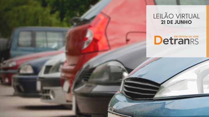 Imagem desfocada de vários carros estacionados lado a lado. Em texto, se lê: leilão virtual 21 de junho / Em defesa da vida etranRS